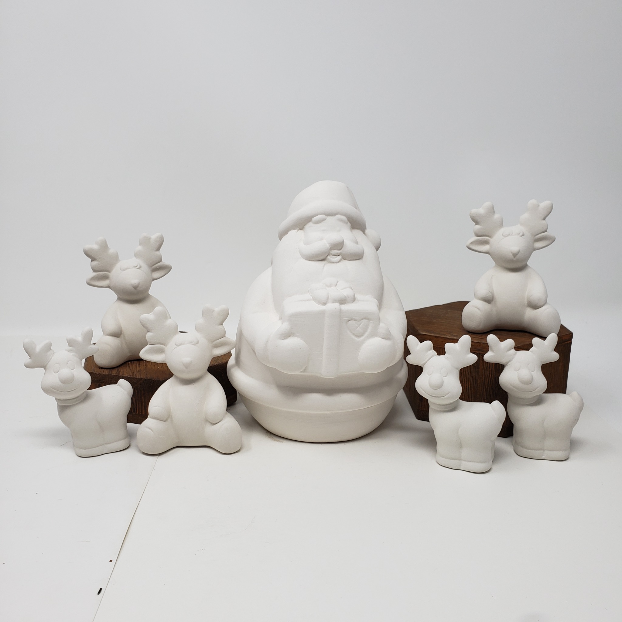 Unpainted Santa and reindeer ceramic pieces